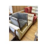 An upholstered two seater settee, a wing