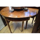 A mahogany D-end dining table, with an e