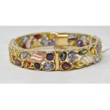 A 14ct tri-coloured gold bangle set garn