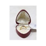 An 18ct gold and solitaire diamond ring,
