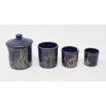 A blue pottery jar and cover, with three