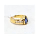 A sapphire and diamond ring, the pear sh