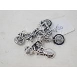 A silver novelty miniature motorbike, an