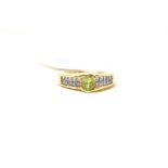 A 14ct gold, peridot and diamond ring, a