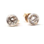 A pair of diamond stud earrings