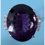 A large amethyst and diamond ring, in a