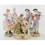 A Volkstedt porcelain group, of a courting couple, 20.5 cm high, and two other pairs of figures, the