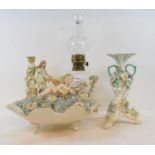 A Volkstedt porcelain table oil lamp, on cherub supports, 19 cm high including fitment, and other