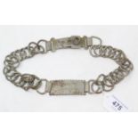 A 19th century chain link steel dog collar, H T Urmine, Sheerness, 2.5 cm deep