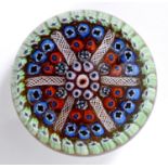 A Clichy style paperweight, with millefiori decoration, 6 cm diameter See illustration