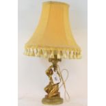 A gilt bronze table lamp, in the form of a figure wearing a lion skin with horn of cornucopia aloft,