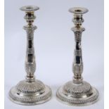 A pair of George III silver candlesticks, with palmet and other decoration, probably John