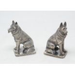 A pair of silver novelty cruets, in the form of seated Alsatians, 7 cm high (2)