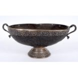 A Colonial Coco-de-Mer bowl, with silver coloured metal mounts, 34 cm wide See illustration