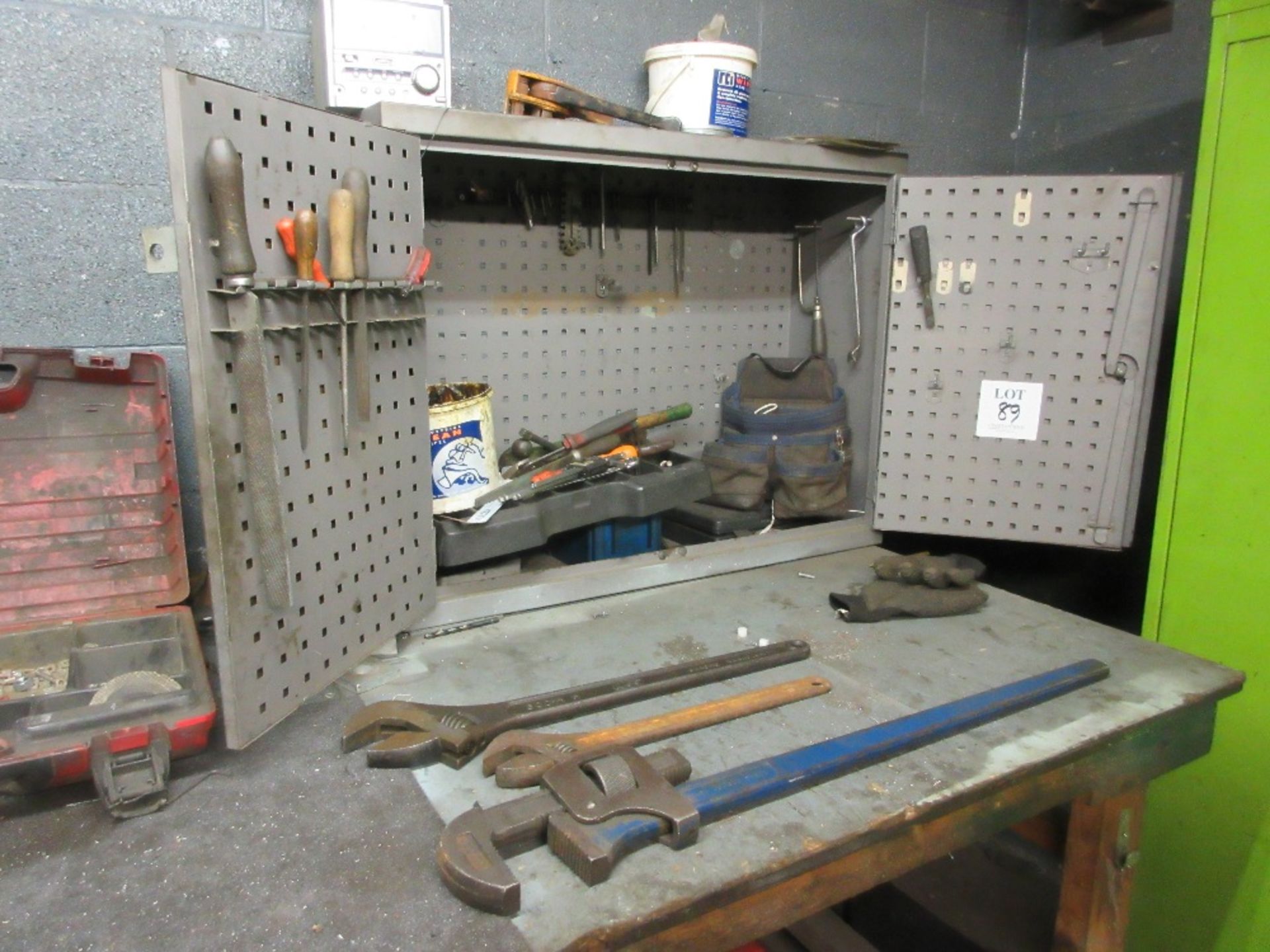 Tool cupboard and contents of room including vice and racking