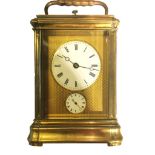 UNSIGNED Late xx century A french brass carriage clock in a bronze case ,enamel roman black dial ,