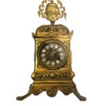 UNSIGNED An early mantel bronze clock engraved with follage ornamental Movement , roman blu numerals