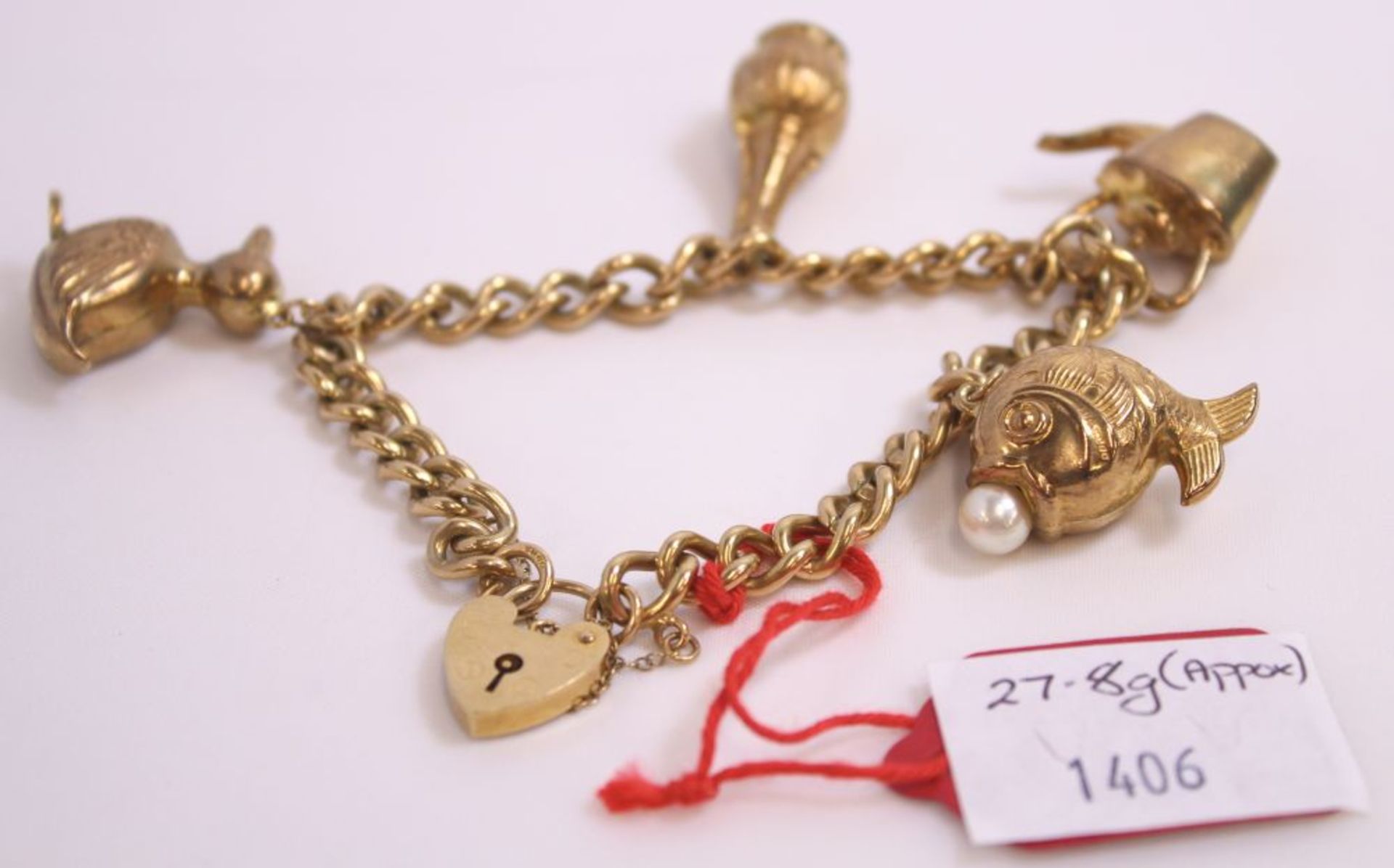 9ct Gold Charm Bracelet with Five 9ct Gold Charms (one with pearl?) 27.8g (Est. £300-£400)