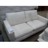 This is a Timed Online Auction on Bidspotter.co.uk, Click here to bid. A Cream Two Seater Sofa (