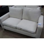 This is a Timed Online Auction on Bidspotter.co.uk, Click here to bid. A Cream Two Seater Sofa (