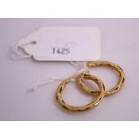 This is a Timed Online Auction on Bidspotter.co.uk, Click here to bid. A pair of 18ct Gold Hoop