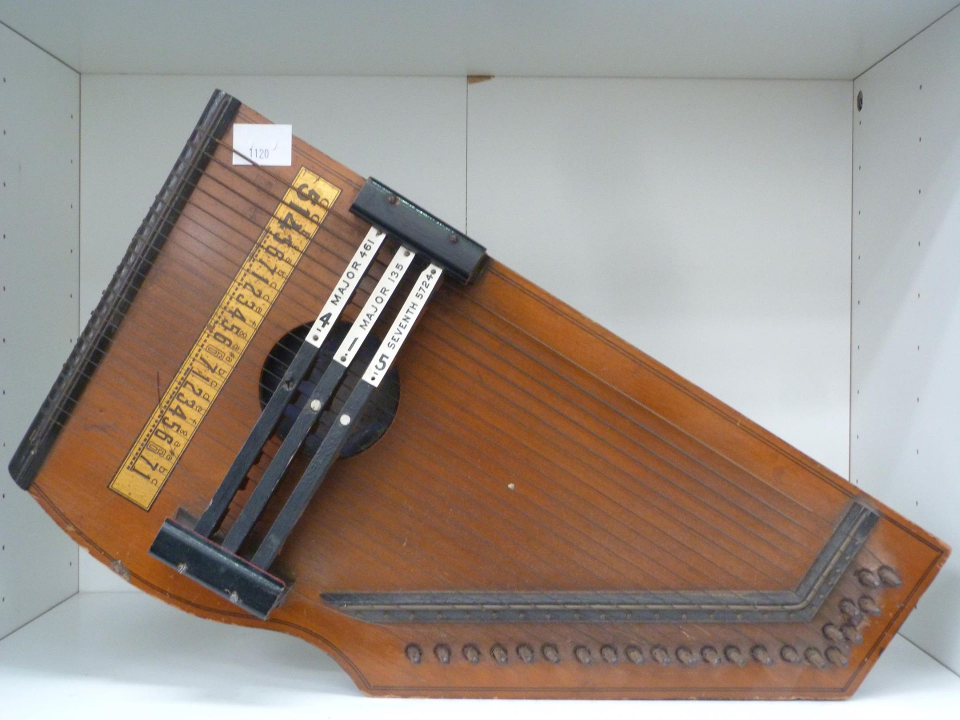 A Zither (Brand Name indecipherable) (est. £30-£70)