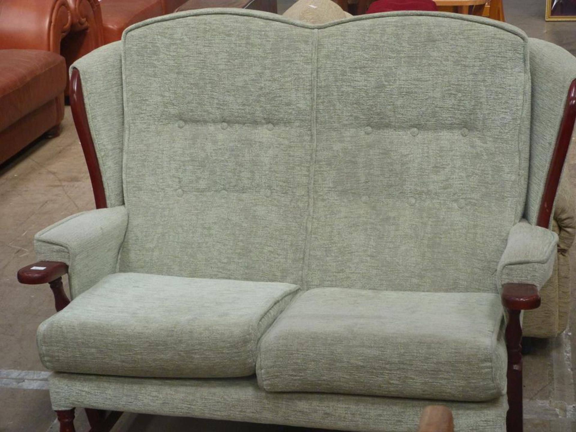 A pale Green Upholstered Wing Fireside style two seater Settee (est £30-£50)