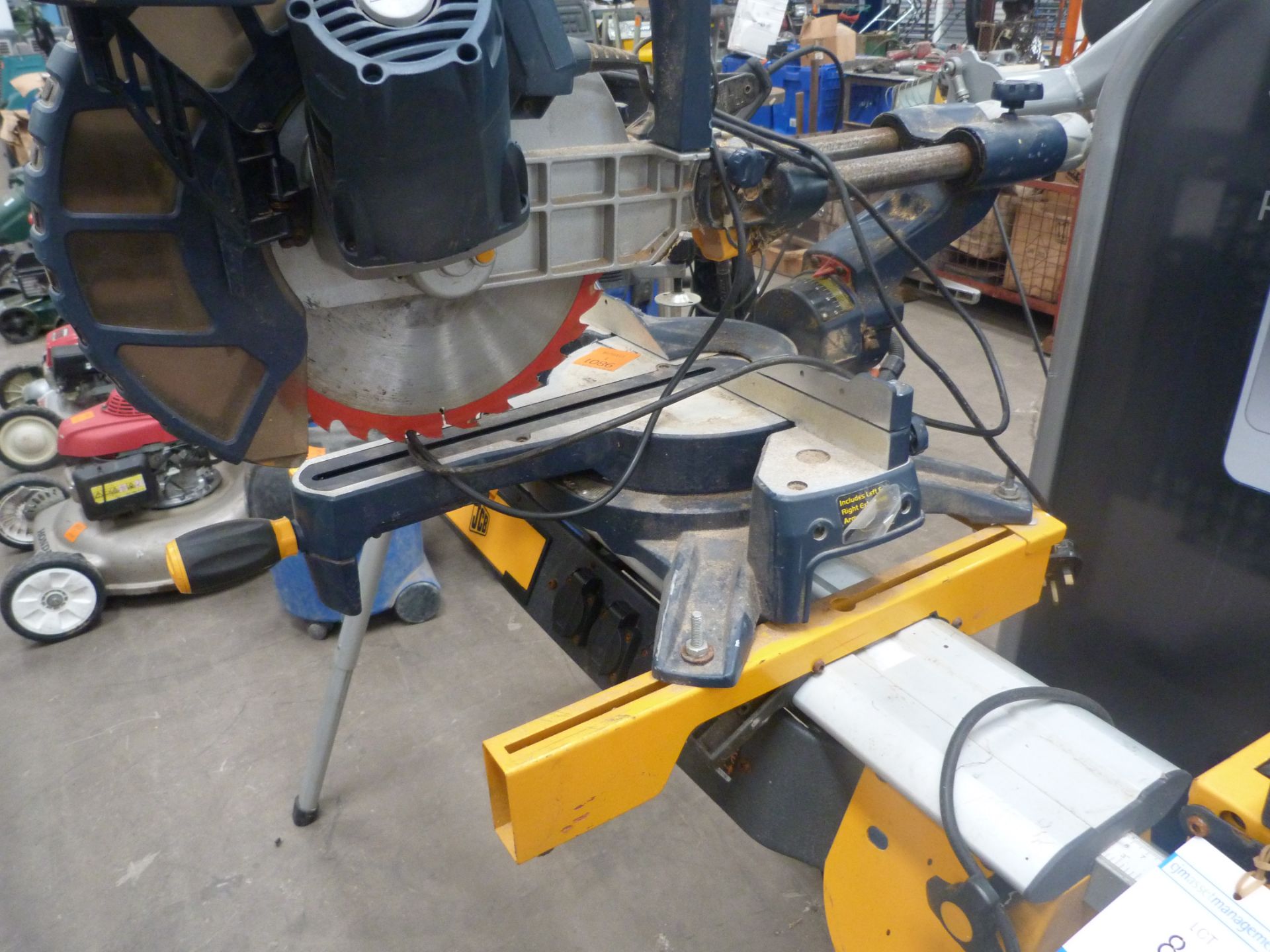 A JCB Mitre Saw, Work Bench (Wheeled) with Extending Legs and Fitted with three power points (Bed - Image 12 of 13