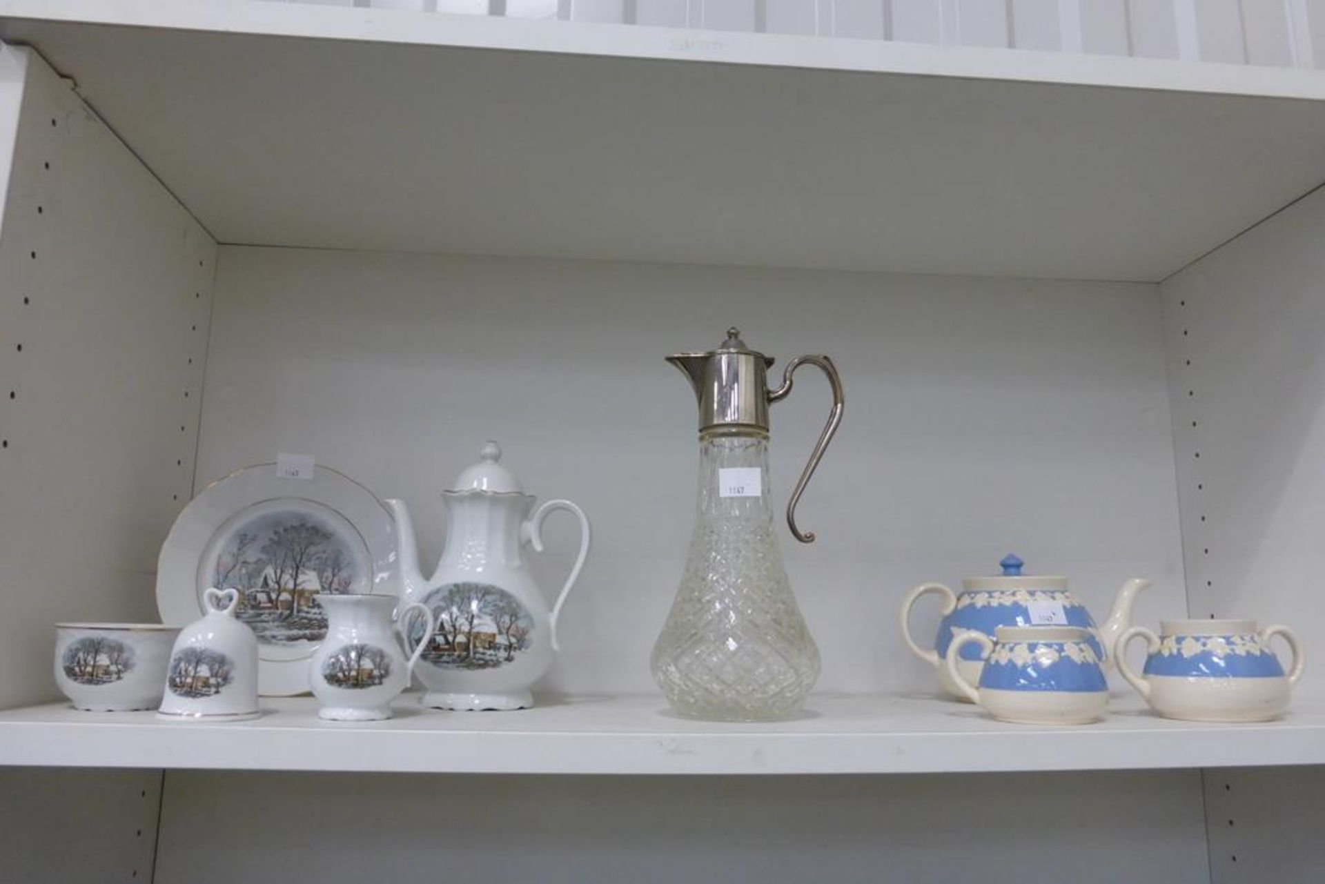 A shelf to contain a silver plated topped Claret Jug, five pieces of Avon Crown Bavaria quality