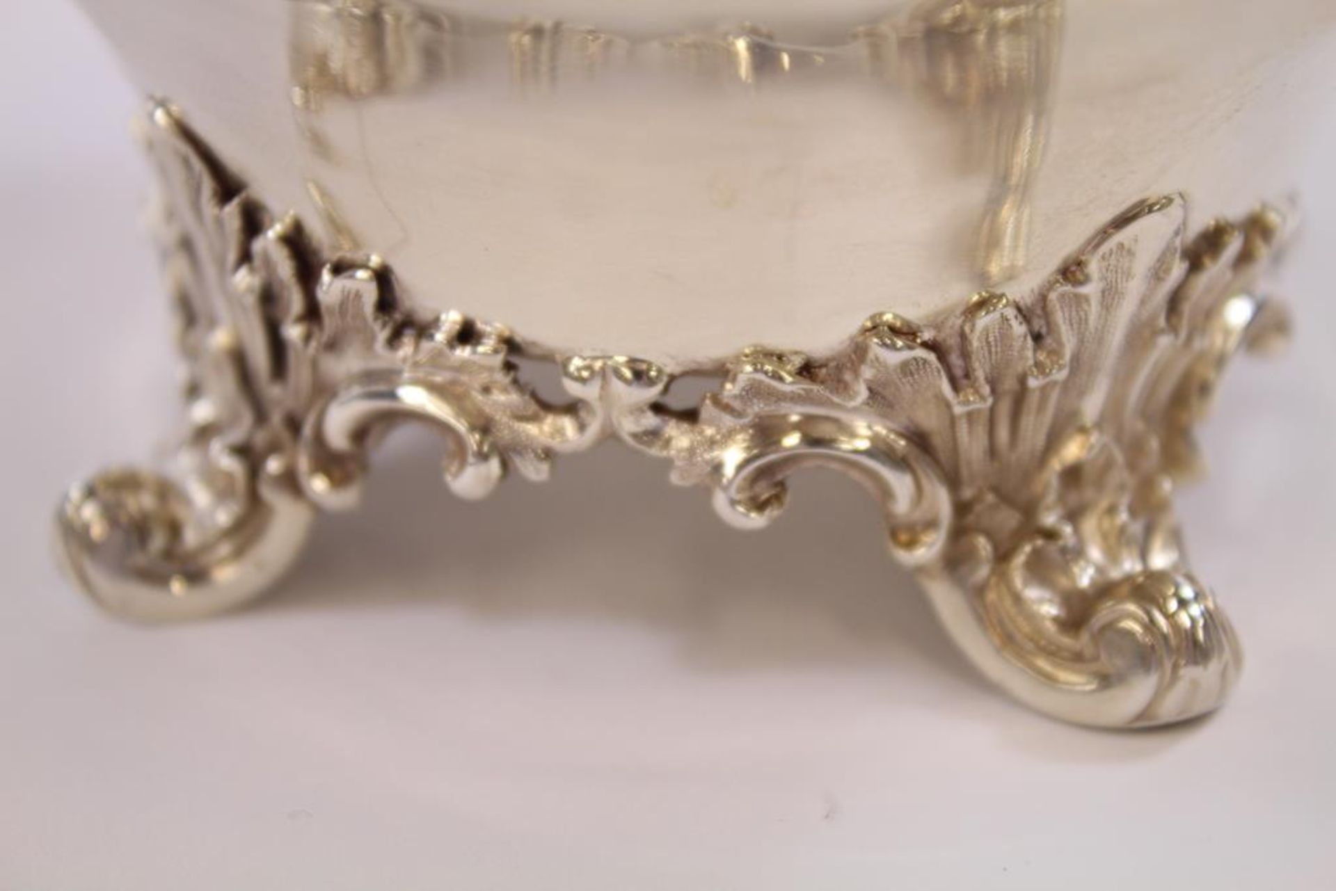 A William IV silver Cream Jug of bulbous form with scroll handle, ornate rim and curving supports ( - Image 2 of 2
