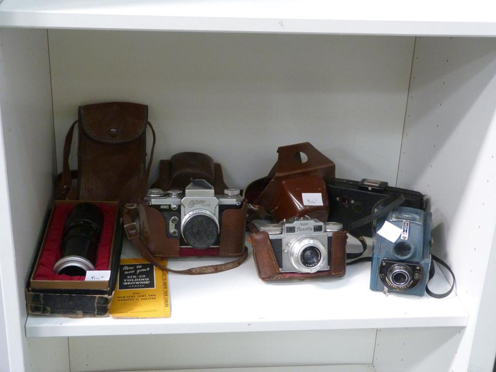 A lot to contain cameras, including a 'Super Paxette' Camera, 'Adixa Flex' Camera, 'six-20