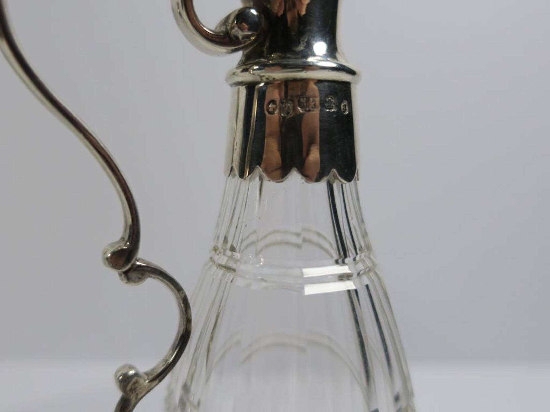 A pair of Victorian Scottish silver mounted ovoid cut glass Ewers with scroll handles and plain - Image 7 of 20