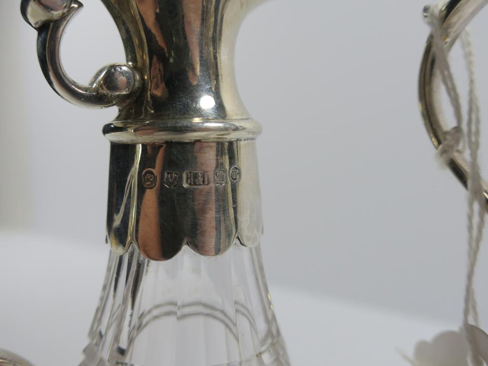 A pair of Victorian Scottish silver mounted ovoid cut glass Ewers with scroll handles and plain - Image 11 of 20