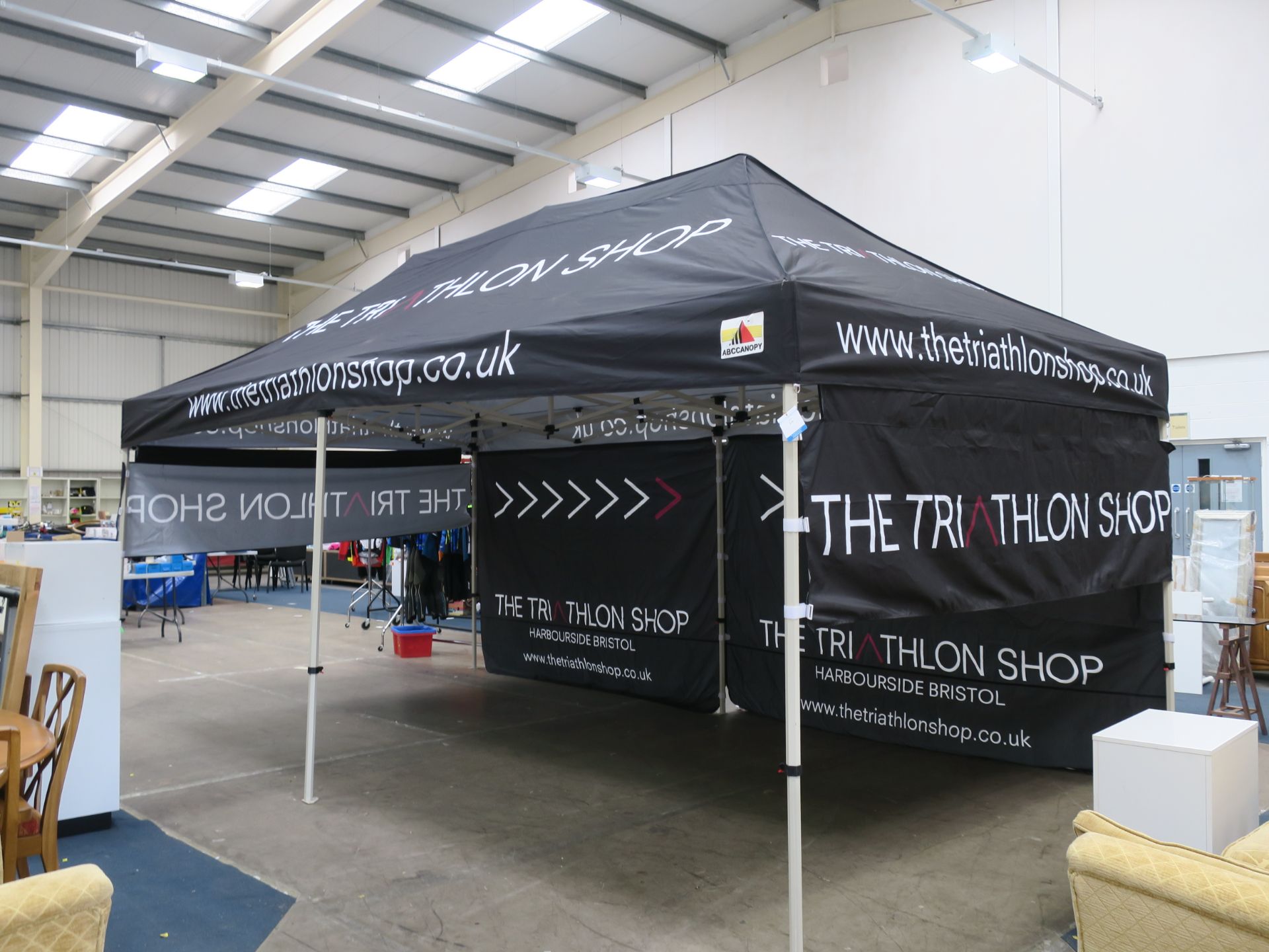 * An ABC Canopy made Event Stand/Gazebo. Please see pictures which show the graphics on the