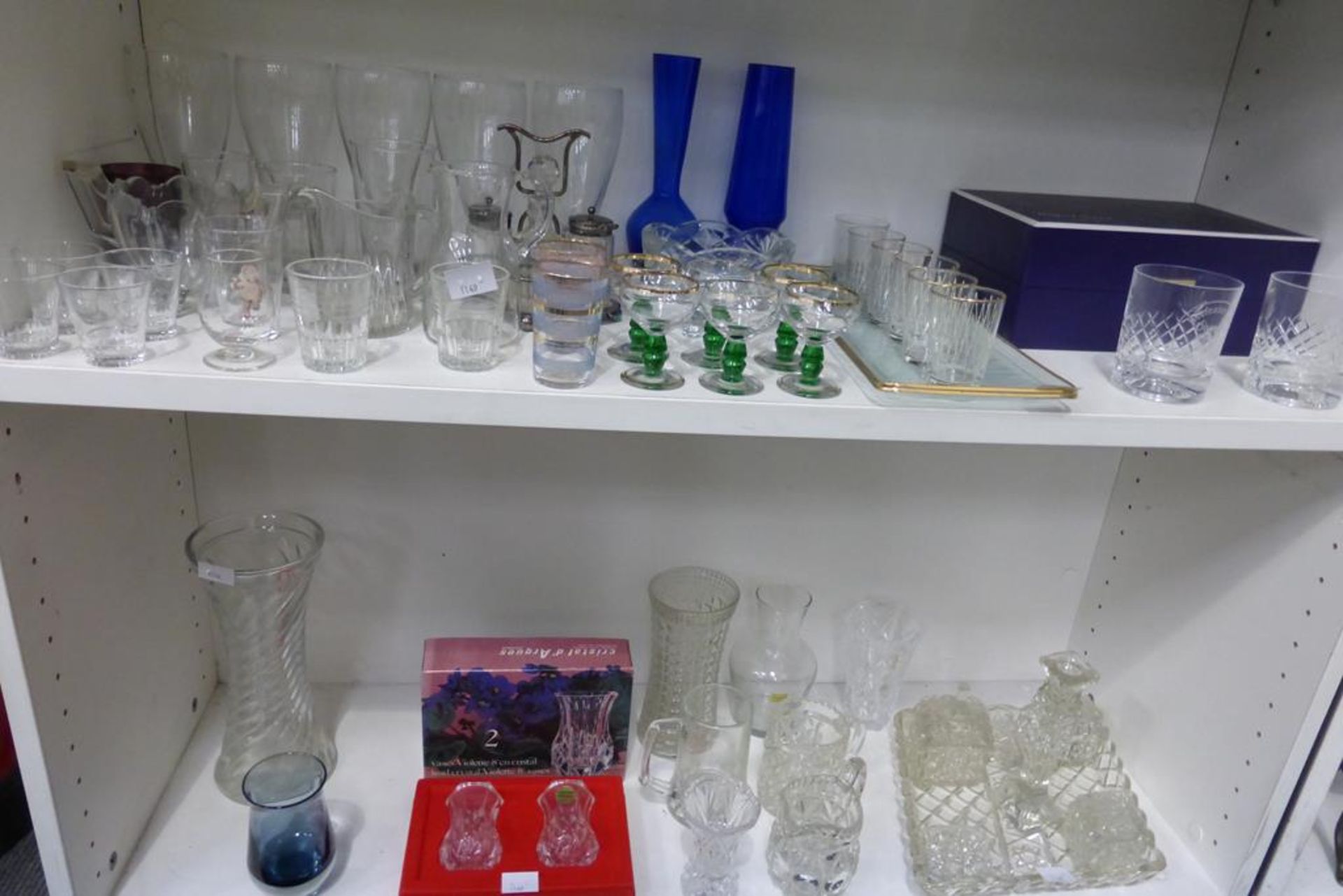Two shelves featuring glassware including two boxed Watford crystal drinking Glasses, two 'Cristal