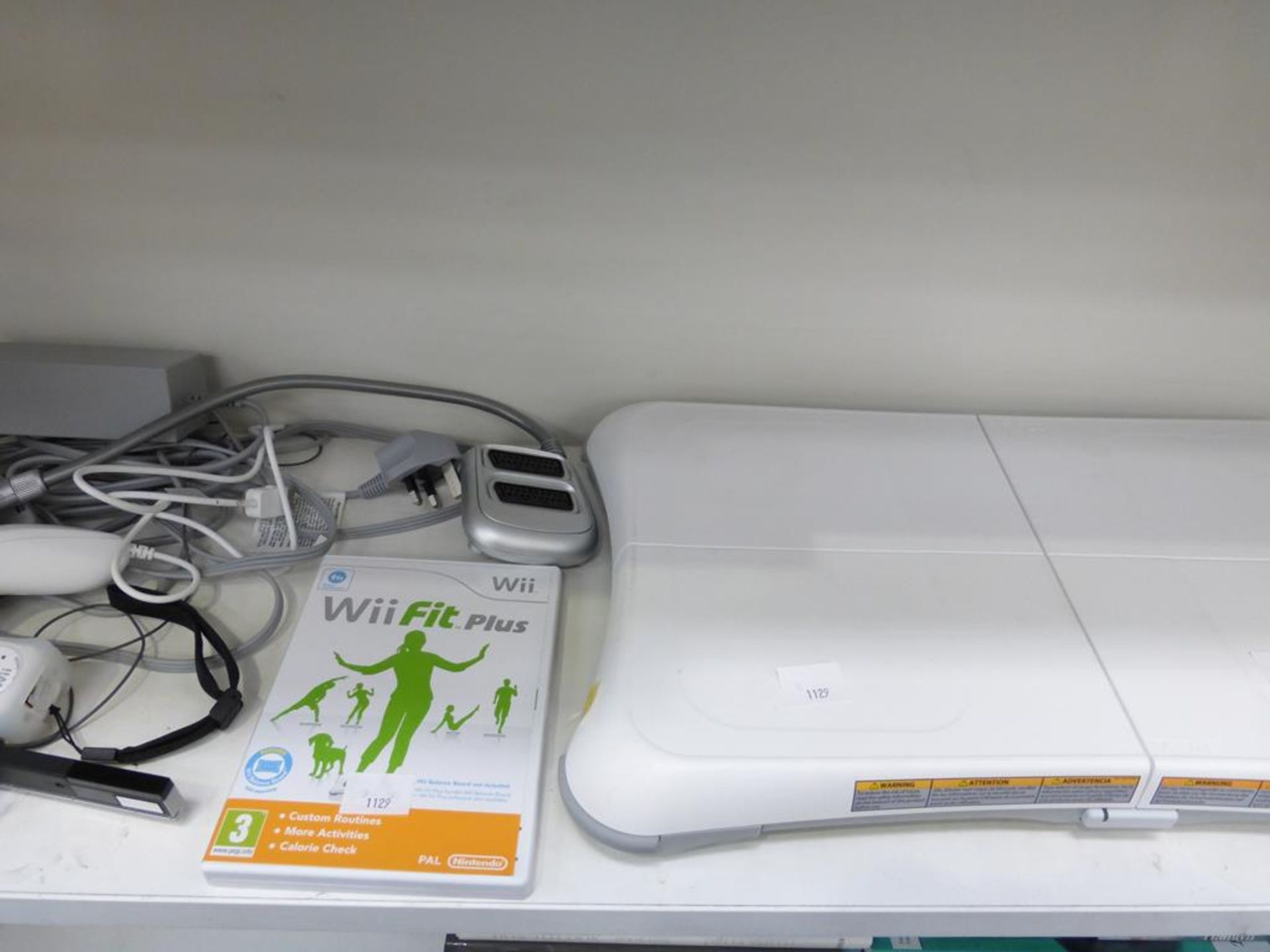 A shelf to contain a Nintendo Wii, WiiFit Board, WiiFit Plus game, Controller, Nunchuck etc (est £