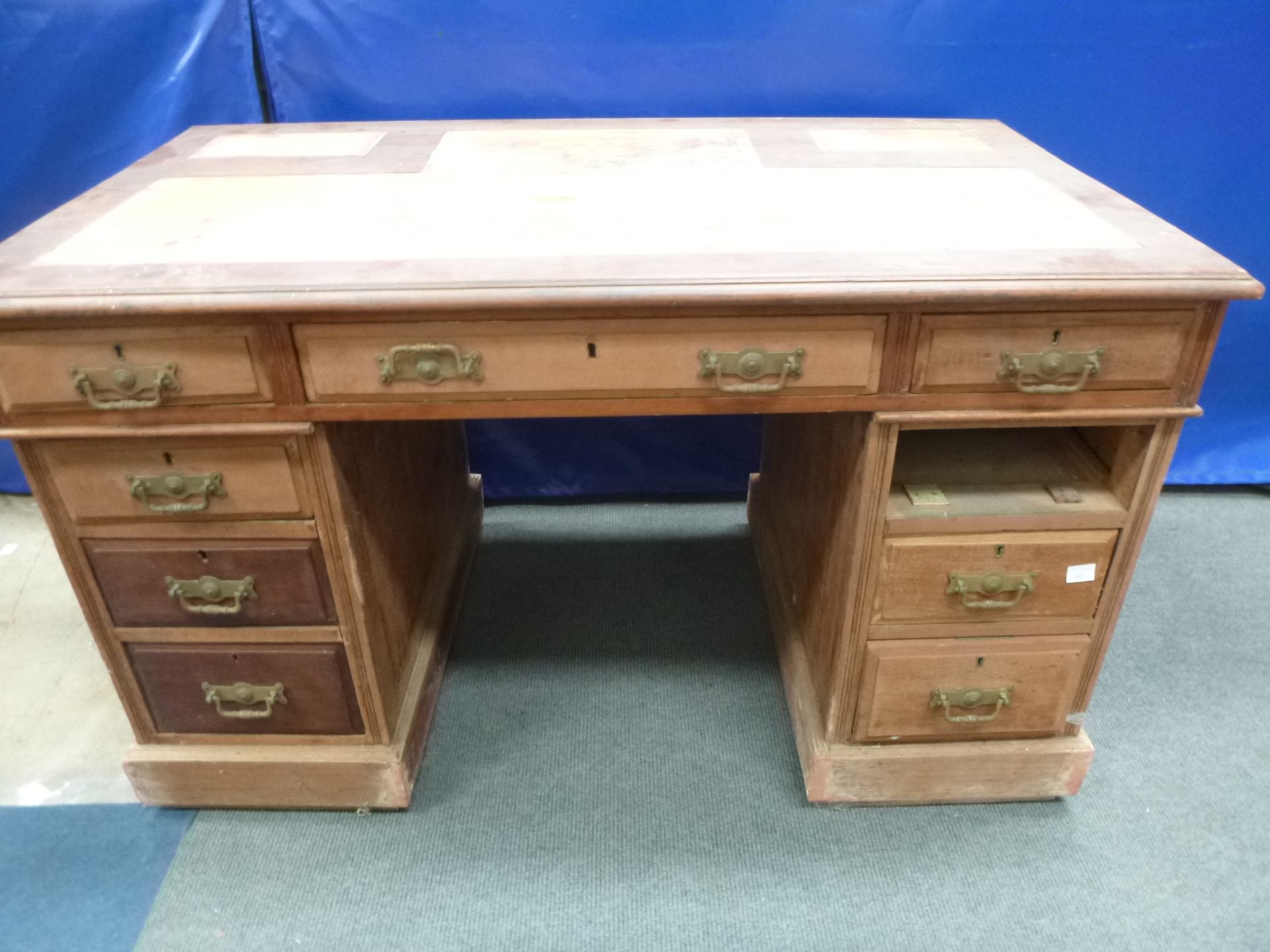 An early Twentieth Century Walnut (?) Pedestal Desk (for restoration) with Frieze Drawers to the top