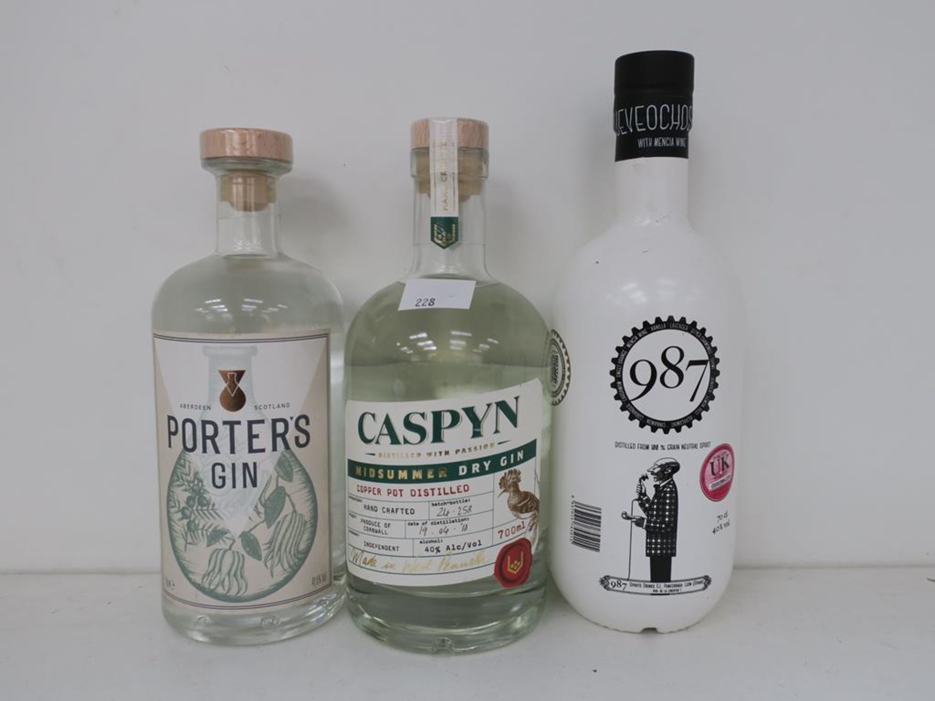 * Three bottles of Gin: a 70cl bottle of Caspyn Midsummer Dry Gin 40% vol, a 70cl bottle of 987