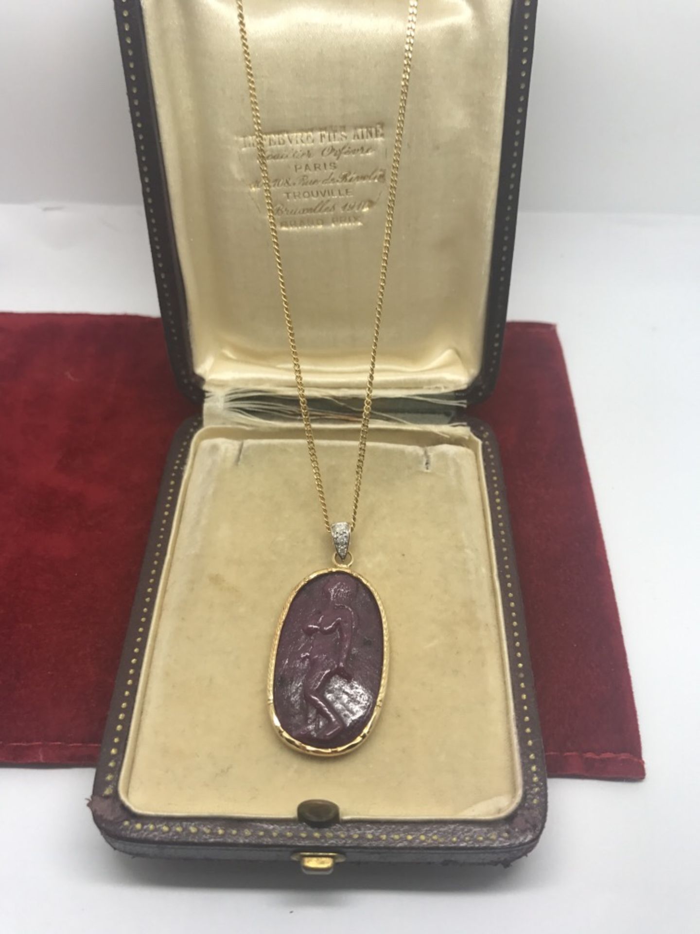 25.00ct RUBY CARVED RUBY PENDANT SET WITH A DIAMOND IN 18ct GOLD