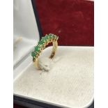 EMERALD ETERNITY RING SET IN YELLOW GOLD TESTED AS 18ct GOLD