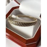 9ct GOLD DIAMOND SET BANGLE