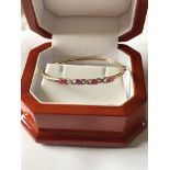 9ct GOLD RUBY & DIAMOND SET BANGLE