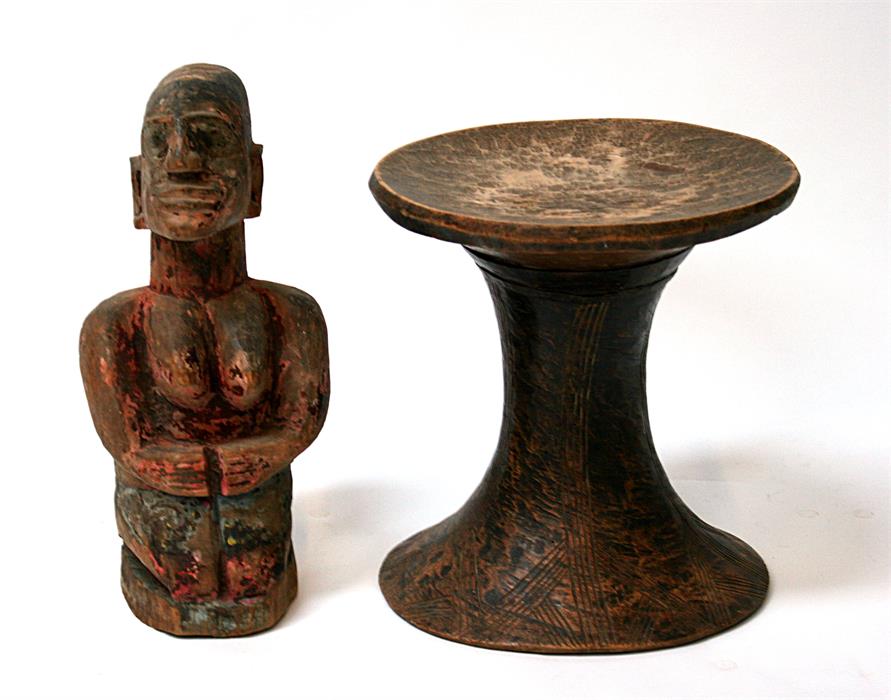 An African tribal stool of waisted from, together with a tribal figure depicting a mother and child,