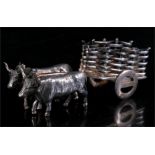 A continental silver model of a bullock and cart, having a Spanish star mark. 10cm (4ins) long.