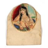 A 19th century oval portrait miniature of a young Eastern woman, inscription to verso. 5cm by 6cm (2