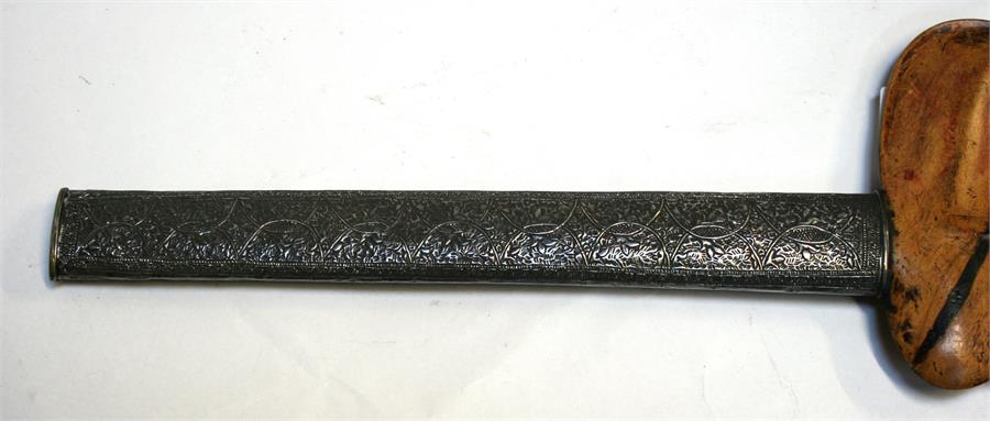 An Indonesian Kris dagger with wavy ornate blade and intricately carved handle, in silver covered - Image 2 of 12