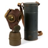 WWII gas mask in metal container