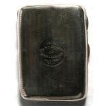 A silver cigarette case, Chester 1915, later inscribed ' from the S.S.Stokers of HMS Vanguard