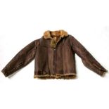 A WWII Irvin pattern sheepskin fleece lined leather flying jacket, with Air Ministry label dating to