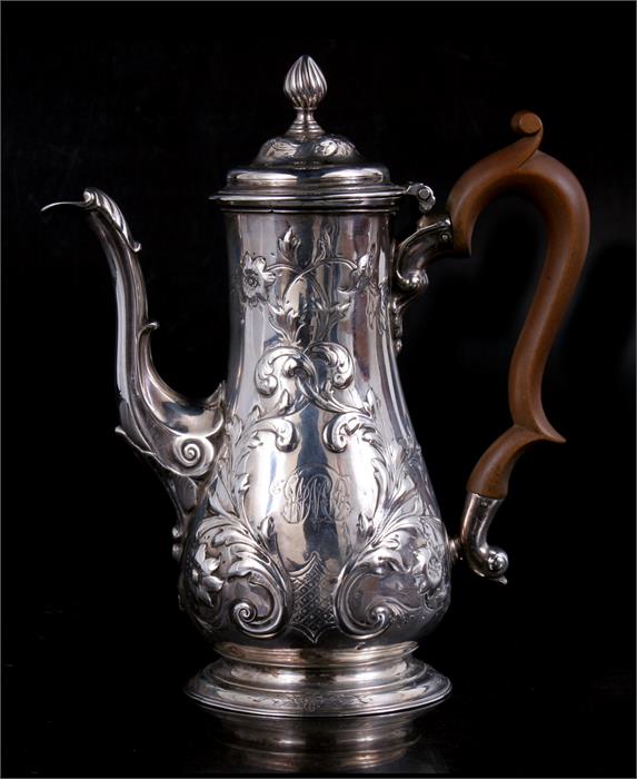 A Georgian embossed silver coffee pot by Alexander Johnston. Rubbed hallmark, appears to be London